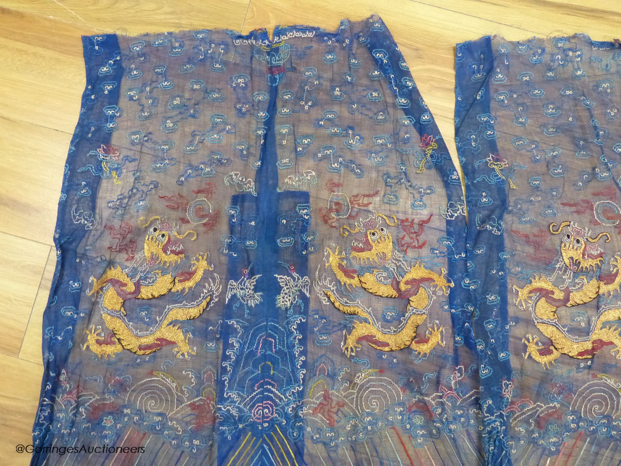 Two Chinese finely woven gauze panels with gold dragon embroidery, early 20th century